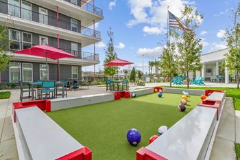 A playground with a slide, ball pit, and climbing wall at Pinnacle Apartments, Jacksonville, FL